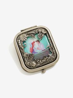 <div>The iconic image of Ariel and Prince Eric from Disney's <i>The Little Mermaid</i> conceals a mirror compact. Inside a metal story frame of seashells and sea creatures, the "Kiss the Girl" moment is captured forever. Open the hinge top to reveal your new favorite mirror compact.<br><ul><li style="list-style-position: inside !important; list-style-type: disc !important">Officially licensed</li&g... Ariel And Prince Eric, Story Frame, Beach Pastel, Mermaids Kissing, Disney Room Decor, Disney The Little Mermaid, Mermaid Ring, Mirror Compact, Disney Ornaments