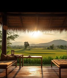 the sun shines brightly over an outdoor area with wooden benches and grass fields in the background