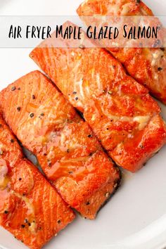 four pieces of salmon on a plate with the words air fryer maple glazed salmon