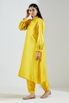 Yellow straight long kurta with striped pattern, seam pockets and cuff sleeves. Comes with salwar.
Components:2
Neckline:Stand Collar
Sleeve Length:Full
Fabric:Chanderi
Color:Yellow
Cuff sleeves
Seam pocket
Striped pattern - Aza Fashions Festive Kurta With Gathered Sleeves, Traditional Kurta With Set-in Sleeves For Work, Workwear Straight Kurta With Set-in Sleeves, Festive Kurta With Button Cuffs, Striped Kurta, Embroidery Stand, Chanderi Dupatta, Long Kurta, Kurta Set For Women