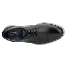 If you're trying to decide between comfort and style, choose both with the Harris oxford by Vintage Foundry Co. This lace-up design blends classic sophistication with modern flair, resulting in a shoe that is both timeless and trendy. The impeccable craftsmanship ensures a polished look, while the superb comfort makes it perfect for all-day wear. Elevate your wardrobe with the Harris oxford, where elegance meets exceptional comfort for any occasion. Classic Black Lace-up Oxfords, Black Lace-up Oxfords For Semi-formal Occasions, Classic Black Dress Shoes With Perforated Toe Box, Classic Black Lace-up Shoes With Perforated Toe Box, Black Lace-up Shoes For Derby, Classic Oxford Lace-up Dress Shoes, Masculine Black Oxfords For Business Casual, Black Formal Oxfords With Cushioned Footbed, Black Cushioned Oxfords For Formal Wear