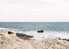 there is a large body of water next to the rocks