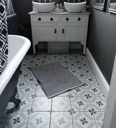 a bathroom with two sinks and a bathtub