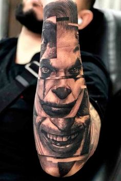 a man with a tattoo on his arm that has a joker face