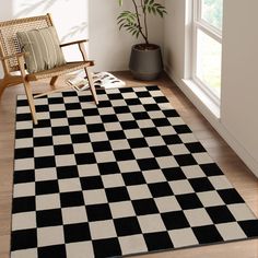 a black and white checkered area rug in a living room with a rocking chair