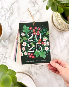 Featuring 12 Full Color Illustrations of each month, accompanied by Paper Raven Co. signature florals, botanicals and hand lettering, this 2025 Floral Calendar is perfect for any space! 

12 Full Color Illustrations
Calendar measures 5x7"
Calendar comes with twine, ready to hang
All pages are printed on thick, matte 110lb paper
Proudly produced in the USA
Ships in a plastic sleeve for protection Botanical Calendar, Illustrated Calendar, Hanging Calendar