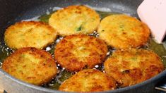 some fried food is cooking in a frying pan