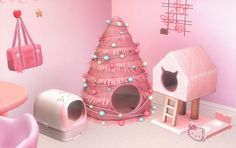 a pink room with a cat house and toys