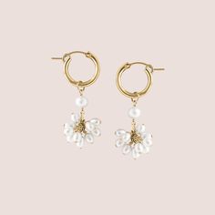 Inspired by the delicate charm of blossoming flowers, these iridescence hoops feature freshwater pearls individually hand wrapped and perfectly placed on to a pair of hoop earrings. Each piece is handcrafted to order, right here in our Salt Lake City studio by one of our skilled artisans. Make it a set with our matching Pearl Blossom Collection.