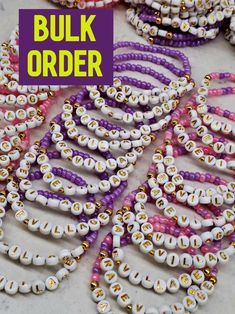 "This listing is for BULK ORDERS ONLY You can make different designs for each bracelet. In bulk orders and special days, production and cargo delivery may take a long time. Therefore, it is better to order 15 days in advance.  Ready to ship in 10 pcs - 200 pcs 3-5 business days 200 pcs - 500 pcs 5-7 business days 500 pcs - 1000 pcs 1 week Bulk orders are for 10+ more of these bracelets, customized by you. These are great for an event, fundraiser, sports team, team building gifts, wedding parties Customized Purple Beaded Bracelets For Gift, Customized White Beads For Gifts, Handmade Purple Name Bracelet With Round Beads, White Beaded Bracelets For Gift Making, White Beaded Bracelets With Colorful Beads For Gifts, Customized White Beaded Bracelets For Crafting, Customized Purple Beaded Bracelets With Round Beads, Customized Purple Beaded Bracelets, Customized Purple Round Beaded Bracelets