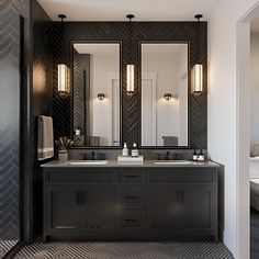 a bathroom with two sinks and three mirrors