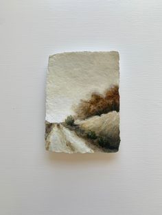 a piece of paper with a painting on it