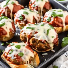 mini meatball pizzas with sauce and cheese on top