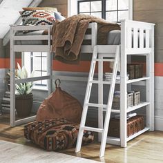 a white bunk bed sitting in a bedroom next to a window with an orange striped wall