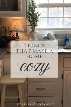 a white kitchen with the words things that make a home cozy