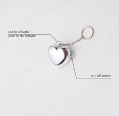 a heart shaped keychain with instructions on how to use it