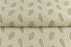 a close up view of the fabric on a bed sheet with an intricate design in beige and white