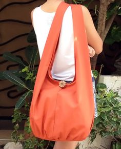 This hobo bag made from canvas fabric. This sturdy and durable bag is useful and big enough for all your daily essentials. The strap is long, it can be cross-body or sling over your shoulder. Material: 100% Canvas fabric Color: Burnt Orange 🎯Feature :  1 interior zipper pocket 1 top zipper closure 📐Measurements: Wide:  21" Height:  13"  Depth:  6" Strap Drop Length:  22" (This is handmade bag, the measurement may be different slightly.) 📚VARIATIONS COLOR :  🌈You can see the color chart here: Tie Dye Bags, Diy Bags Purses, Yoga Mat Bag, Hippie Bags, Mat Bag, Canvas Bags, Sling Bags, Woman Bags Handbags, Hand Woven Pillows