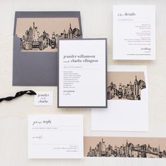 the wedding stationery is laid out on top of each other