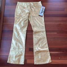 Rare! Nwt Vintage Lip Service Gold Studded Flare Pants 100% Polyurethane Size Large Gold With Silver Buttons One Small Silver Mark On Back Of Leg As Shown Snap And Zipper Closure Gold Fitted Straight Pants, Casual Fitted Gold Pants, Gold Fitted Casual Pants, Metallic Fitted Full-length Pants, Metallic Full Length Fitted Pants, Fitted Straight Leg Gold Pants, Gold Fitted Straight Leg Pants, Casual Fitted Metallic Bottoms, Fitted Wide Leg Metallic Pants