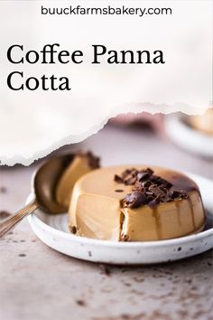 coffee panna cota on a white plate with a spoon in front of it