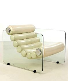 a glass table that has some kind of object on it's back end and is shaped like a roller