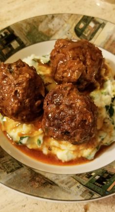 some meatballs and mashed potatoes on a plate