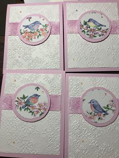 four cards with birds on them and pink trimmings, all decorated in different designs