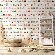 a child's room with colorful wallpaper and toy cars on the wall next to a bookshelf