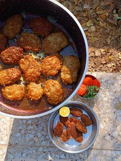 the food is prepared and ready to be eaten in the pot on the table outside