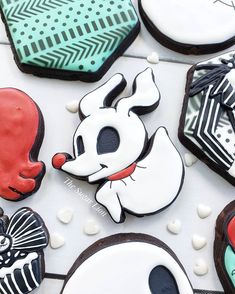 some decorated cookies are sitting on a table