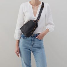 The best way to be is hands-free. Wear Fern Sling as a crossbody or sling it over your shoulder for two looks in one. WHAT IS IT A sling bag. WHY YOU'LL LOVE IT Fern Sling has room for your phone, wallet and keys, and an easy to wear strap for going hands-free. HIGHLIGHTS AND FEATURES 6" W X 8.5" H X 2" D Sandlewood Lining Interior Back: Zip pocket & slip pocket Exterior Back: Signature phone pocket Fits your phone Old English Brass Hardware Zip Closure 13.5" - 21" Strap Drop Solid leather singl Teal Belt, Sage Leaf, Sling Bag Black, Blue Belt, Leather Sling Bag, Crossbody Wallet, Black Crossbody, Phone Wallet, Leather Dress