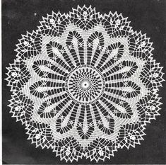 a white doily is shown on a black background