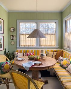 a living room filled with lots of furniture and decor on top of a wooden table