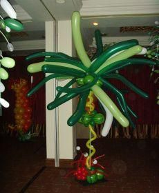 an inflatable palm tree is hanging from the ceiling