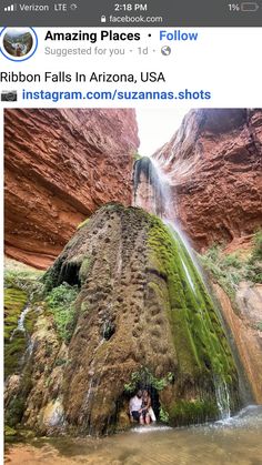 an instagramted photo of two people sitting on a rock in front of a waterfall