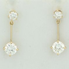 In 14k yellow gold. Contains two 2/3ct and two 1/5ct high quality round brilliant diamonds, VS clarity/I color, great cut for lots of sparkle. 7/8 inches long. Friction backs. 2.2g.   Inventory 17305 Classic 14k Stamped Diamond Earrings, Classic 14k Diamond Earrings, Classic Single Diamond Dangle Earrings, 14k Gold Diamond Earrings With Brilliant Cut Dangle, Pearl Logo, Diamond Dangle Earrings, Gold Price, Dec 8, Brilliant Diamond