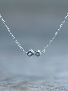 Handmade with love by Gardens of the Sun. Double sapphire necklace with a dainty chain, made from recycled sterling silver. These genuine sapphires are responsibly sourced from Tanzania.