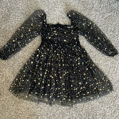 Never Worn, Tulle Black, Gold, Stars Dress! Super Cute And Lined Dress. Wdirara Girl's Polka Dots Mesh Puff Long Sleeve Ruffle Hem A Line Dress Black Mini Length Christmas Dress, Fitted Black Dress By Amazon, Black Fitted Dress By Amazon, Fitted Black Amazon Dress, Amazon Black Fitted Dress, Fitted Black Star Print Dress, Black Fitted Star Print Dress, Black Mini Dress With Star Print, Fitted Black Dress With Star Print