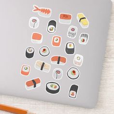 a laptop with sushi stickers on it