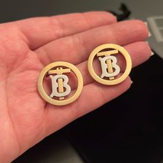 Burberry Gold Monogram Earrings Authentic Preloved In Good Condition- They Do Have Hair Line Scratches I Try To Capture At My Best Did Different Lighting Please See Pictures These Are Absolutely Stunning Will Come In Generic Dust Bag Feel Free To Ask Questions All Sales Are Final Burberry Jewelry, Monogram Earrings, Hair Line, Gold Monogram, Silver Gold, Burberry, Dust Bag, Jewelry Earrings, Monogram