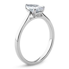 a white gold engagement ring with an oval cut diamond