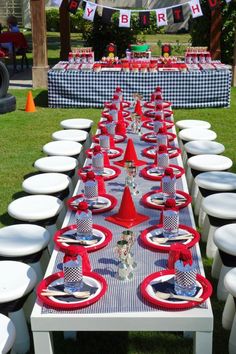 a long table with plates and cups on it