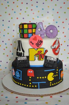 a birthday cake decorated with the number forty and various items on it's side