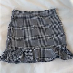 Forever 21 Black And White Checked Pattern Mini Skirt With Ruffle Detail At The Bottom. It Has An Elastic Waist Band And Fits Very Comfortably. It Is Nwt And From A Smoke Free Home. Open To All Reasonable Offers! Happy To Discount On Multiple Items!!! Forever 21 Ruffled Mini Skirt, Forever 21 Fitted Mini Skirt With Ruffles, Forever 21 Ruffled Casual Mini Skirt, Forever 21 Fitted Ruffled Skirt, Casual Ruffled Mini Skirt From Forever 21, Chic Ruffled Bottoms From Forever 21, Casual Ruffled Mini Skirt By Forever 21, Forever 21 Fitted Tiered Skirt Skort, Fitted Ruffled Skirt Bottoms From Forever 21