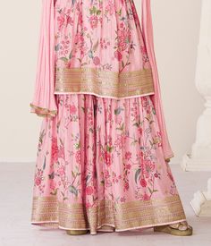 COLOR : Pink FABRIC : Top - Premium Organza Silk, Bottom - Premium Organza Silk, Inner - Santoon, Dupatta - Nazneen WORK : Zari Embroidery, Digital Print, Stones, Sequins, Lace Border OCCASION : Wedding, Reception, Engagement, Party Wear, Festival READY-TO-WEAR : No STITCHING : Available as semi-stitched fabric, can be stitched using standard size option (+$20). Note: There might be a slight color variation due to lighting and flash used during photoshoot. The bright shade seen is the best close Festive Floral Print Embroidered Fabric For Wedding, Silk Sets With Floral Embroidery For Reception, Festive Floral Print Sets For Reception, Floral Embroidered Semi-stitched Anarkali Sets, Anarkali Style Semi-stitched Sets With Floral Embroidery, Silk Floral Print Sets For Reception, Silk Sets With Floral Print For Reception, Traditional Georgette Set With Floral Embroidery, Anarkali Sets With Floral Embroidery In Georgette