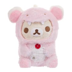 a pink stuffed animal with brown eyes and ears