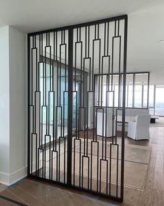 an empty room with glass doors and wooden floors