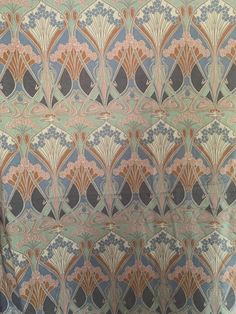 an art deco wallpaper pattern with blue, orange and pink colors