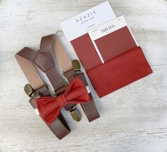 Your special guy will look so handsome when he shows up in his Terracotta Cinnamon bow tie ,  leather brown suspenders and pocket square ! Great set for groomsman, best man or ring bearers - This bow tie & suspenders set is a great choice for family photos, wedding, ring bearer outfit, birthday celebration or any other special occasion.  Please  contact us about FREE COLOR SAMPLES ! PS !You can mix and match different  bow ties and suspenders from our store .  You can also write the note if you Leather Suspenders Men, Ring Bearer Boy, Brown Suspenders, Orange Accessories, Men's Wedding Outfit, Colors 2023, Ring Bearer Gifts, Bearer Outfit, Bowtie And Suspenders